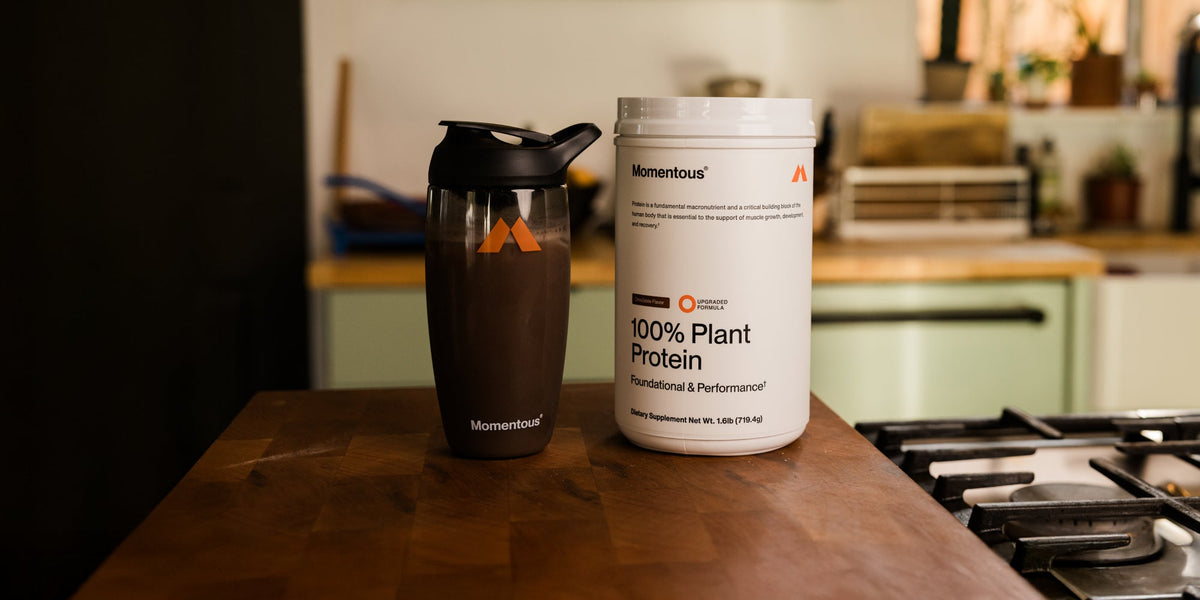 100% plant Protein Jar with a mixer bottle of plant protein powder