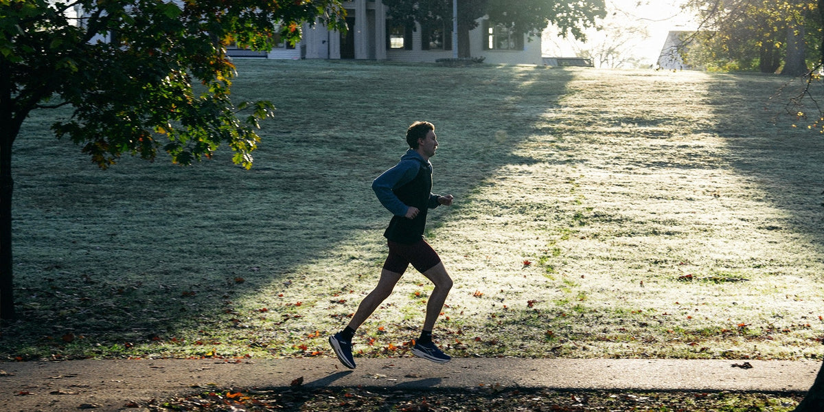 a man runs in the morning sunlight