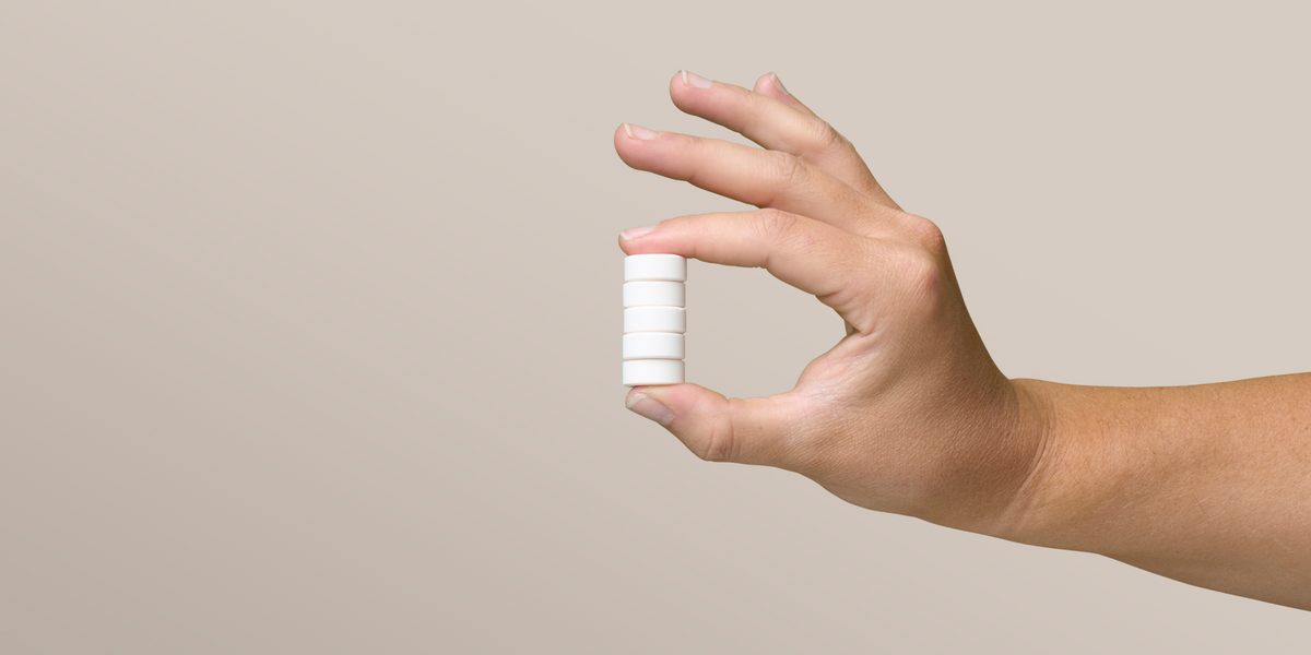 A hand holds some Creatine Chews