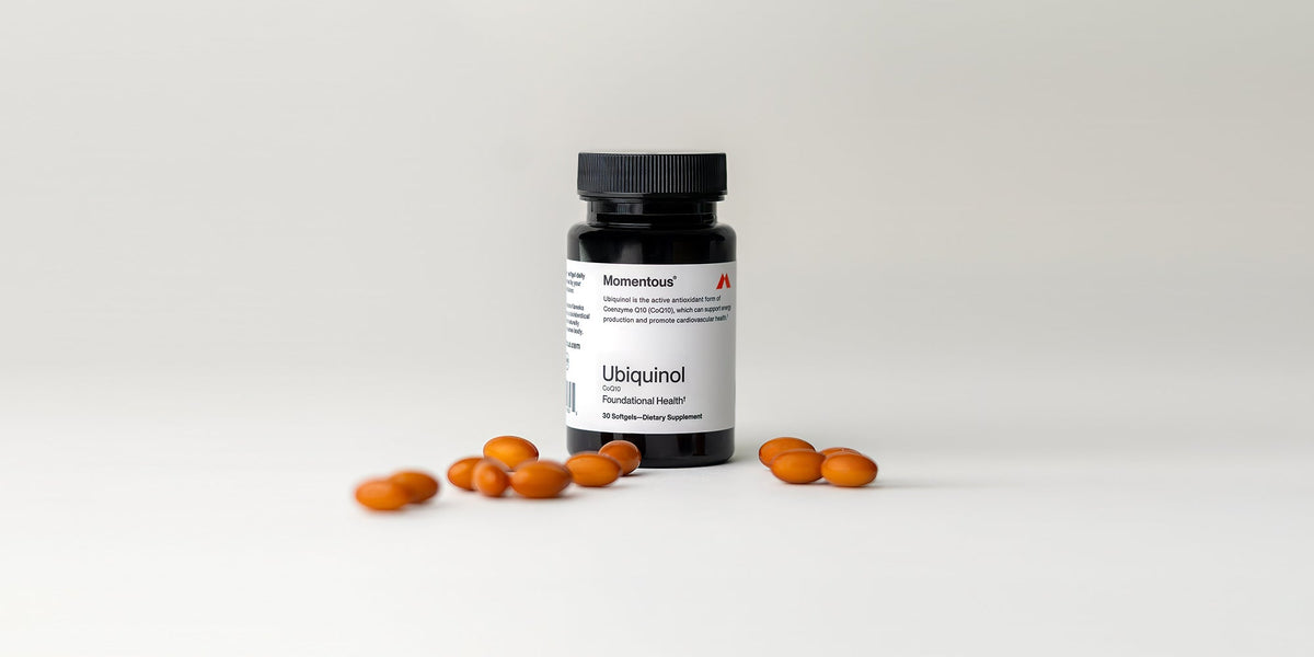 Momentous Ubiquinol bottle with capsules in front
