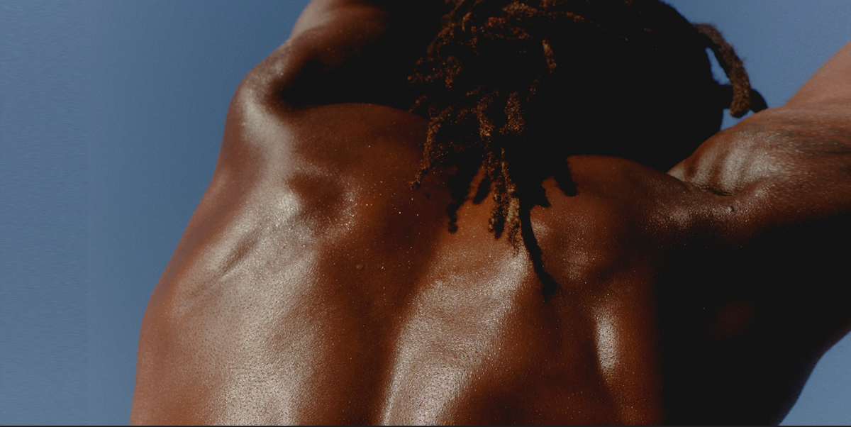 Back of strong man stretching