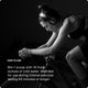 Black-and-white photo of a woman wearing Red Bull-branded headphones, leaning forward while riding an indoor bike trainer. She appears focused and exerting effort. White text on the left side reads: 'HOW TO USE — Mix 1 scoop with 16 fluid ounces of cold water. Intended for use during intense exercise lasting 60 minutes or longer.'