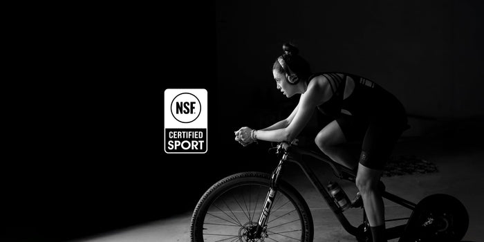 female athlete on indoor bike with NSF Certified for Sport logo overlaid