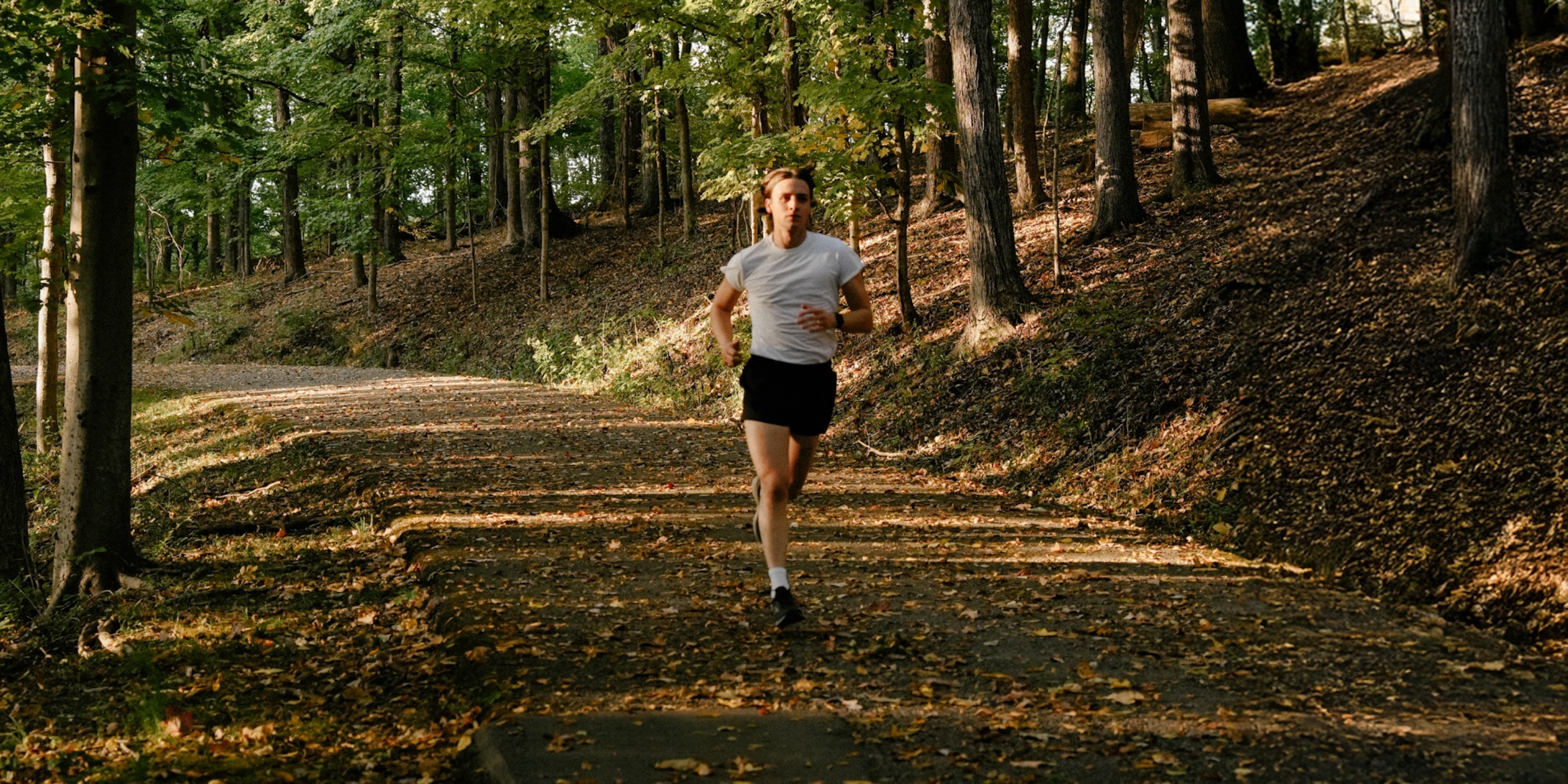 Man running in forest 