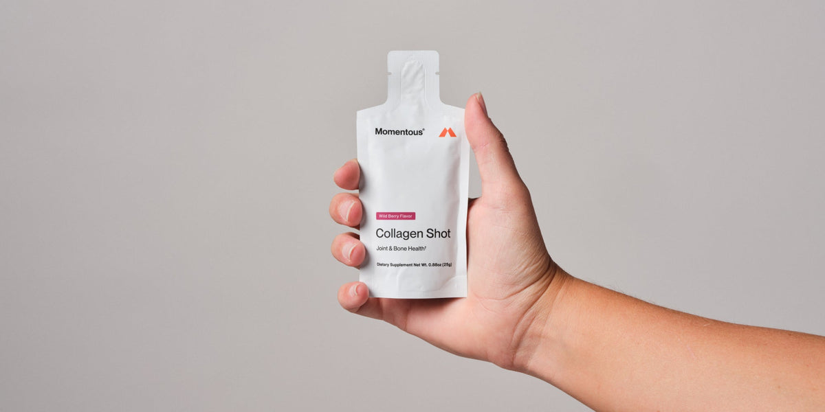 close up of hand holding collagen shot 