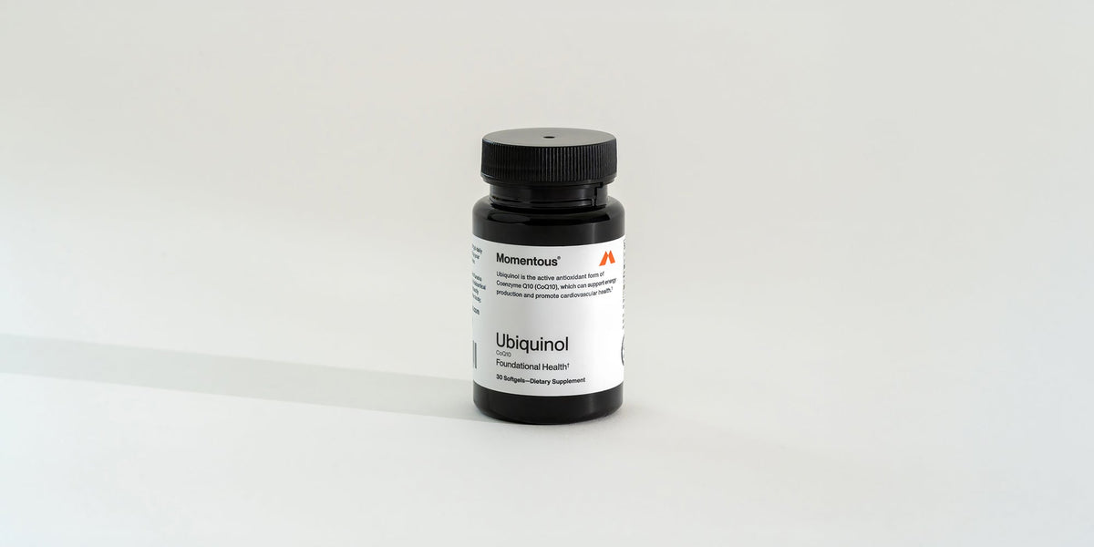 a bottle of Momentous Ubiquinol
