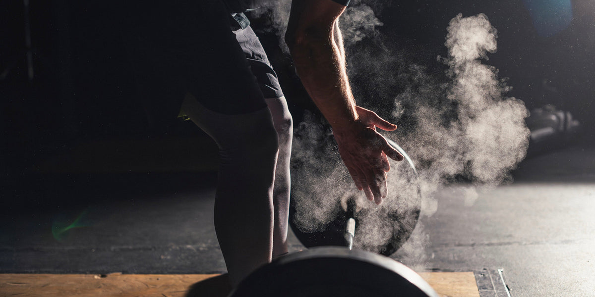A man prepares to lift a barbell