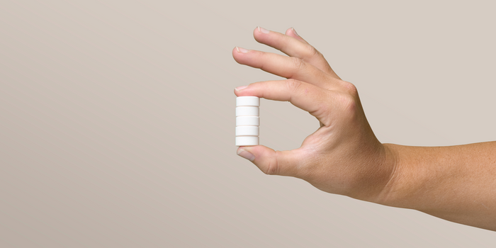A hand holds some Creatine Chews