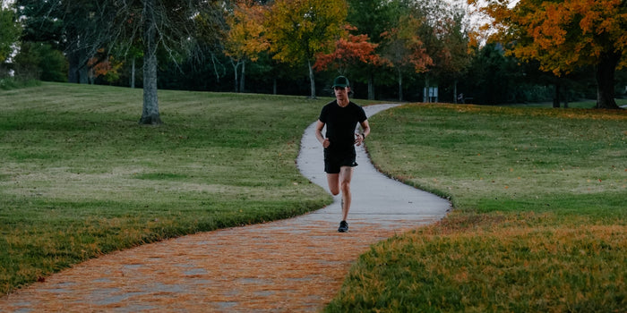 man running through park