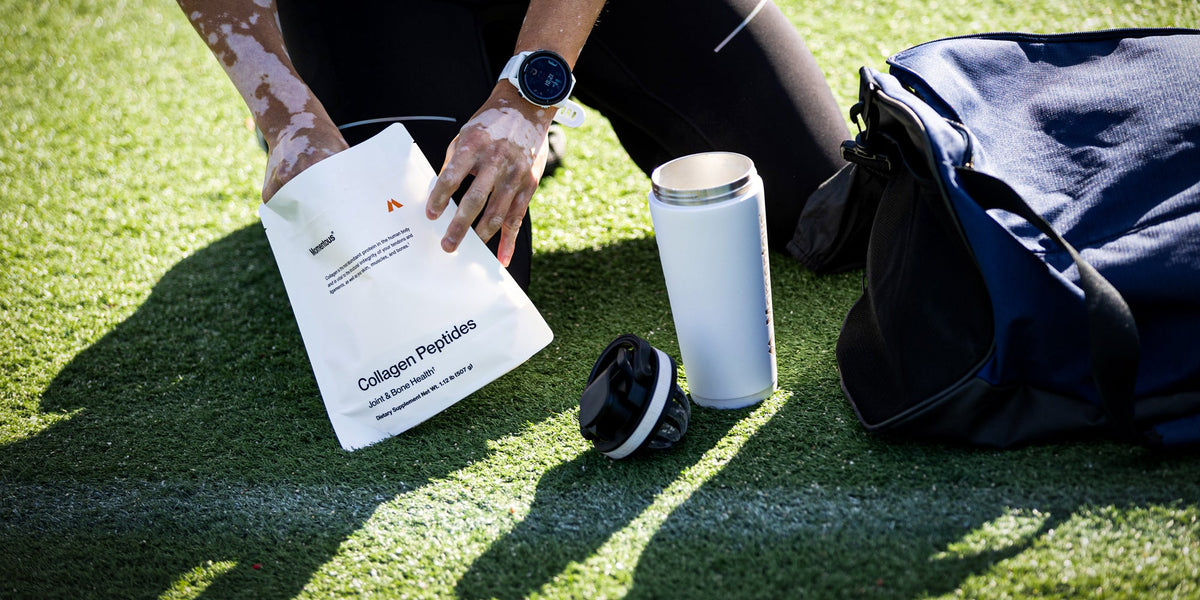 An athlete scoops some collagen peptides powder into their shaker