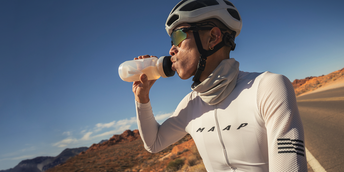 man on bike drinking fuel product