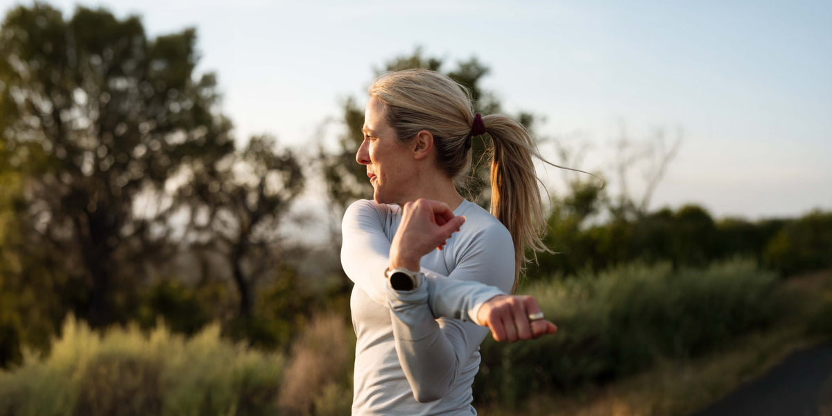 woman stretching outside 