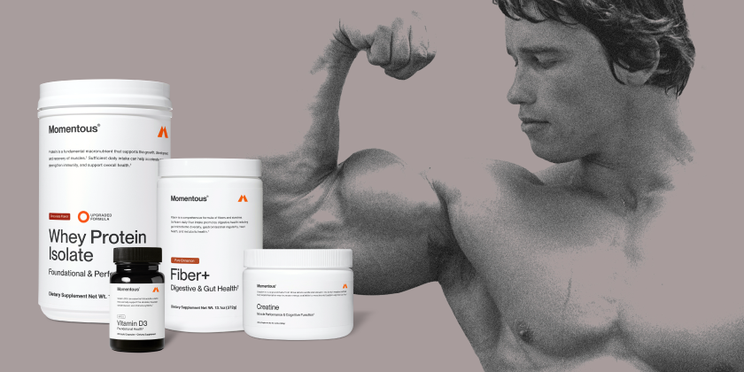 Black-and-white image of Arnold Schwarzenegger flexing his arm beside Momentous supplements including Whey Protein Isolate, Fiber+, Creatine, and Vitamin D3.