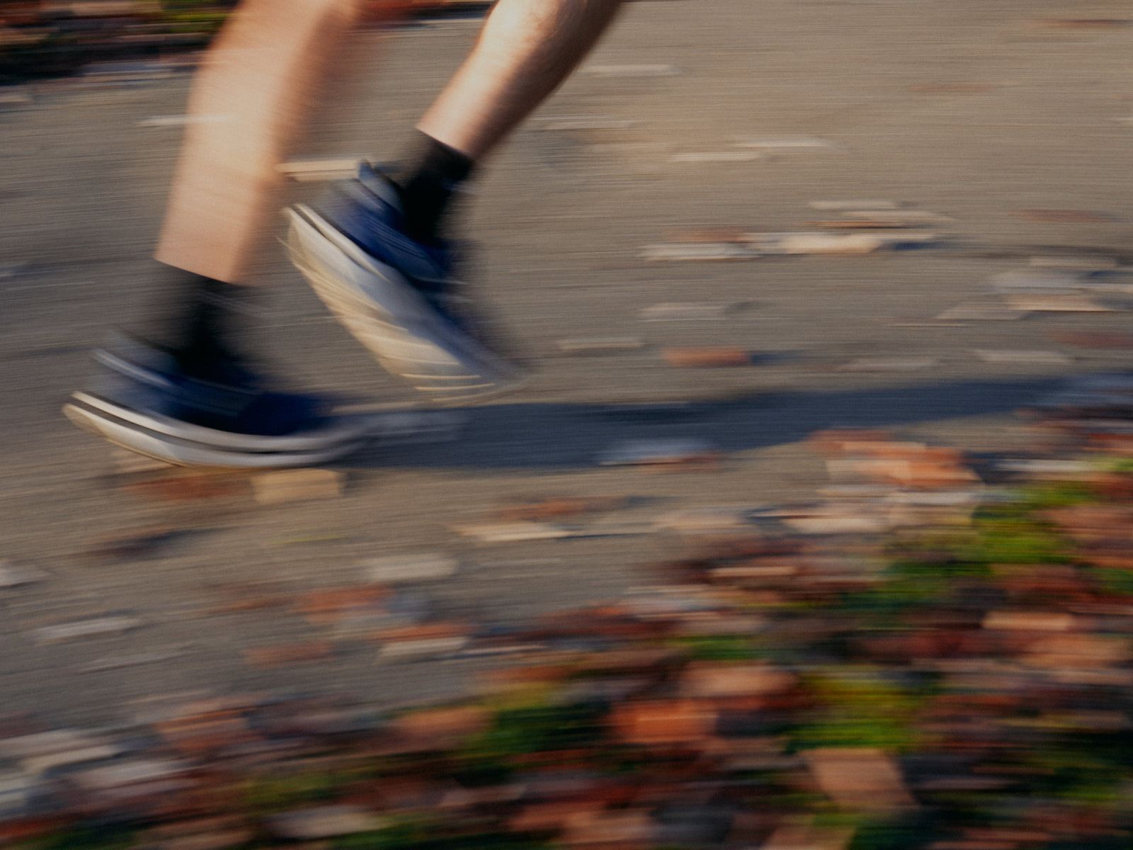 Blurred motion of running legs on a path symbolizing active lifestyle and performance benefits of Momentous Berberine.