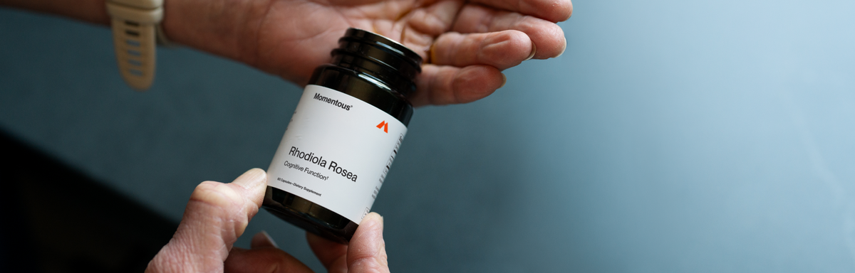 Momentous Rhodiola Rosea, Cognitive Function, 60 Capsules, Dietary Supplement. Person pouring a capsule from the bottle into their open hand