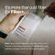 Person opening a white Momentous Fiber+ packet. Text reads: “It’s more than just fiber. It’s Fiber+.” Packet shows “Pure Cinnamon,” “Fiber+,” “Digestive & Gut Health†,” and “Dietary Supplement Net Wt. 0.37 oz (10.4g).” Additional text reads: “Fiber+ goes beyond digestive regularity with a 3-in-1 formula containing soluble fiber, insoluble fiber, and prebiotic resistant starch for full system support.”