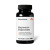 Front view of a Momentous Magnesium Bisglycinate supplement bottle. Black opaque bottle with black cap and white label featuring the Momentous logo and orange triangular 