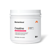 Front view of a Momentous Creatine tub, Watermelon Flavor, 60 Servings. White tub with white lid, Momentous logo and orange 'M' icon. Label reads 'Creatine' with pink Watermelon Flavor banner. 'The Momentous Standard Signature Spec' badge at top right. Benefits: supports cognitive and muscle performance, highest quality pure creatine monohydrate, ultrafine powder for easy mixability. Label shows: Dietary Supplement, Net Wt. 14 oz (396 g), NSF Certified Sport seal.