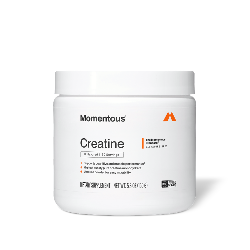 White tub of Momentous Creatine on black background. Label reads: Momentous Creatine – The Momentous Standard Signature Spec – Unflavored, 30 Servings – Supports cognitive and muscle performance, Highest quality pure creatine monohydrate, Ultrafine powder for easy mixability – Dietary Supplement, Net Wt. 5.3oz (150g) – NSF Certified for Sport.