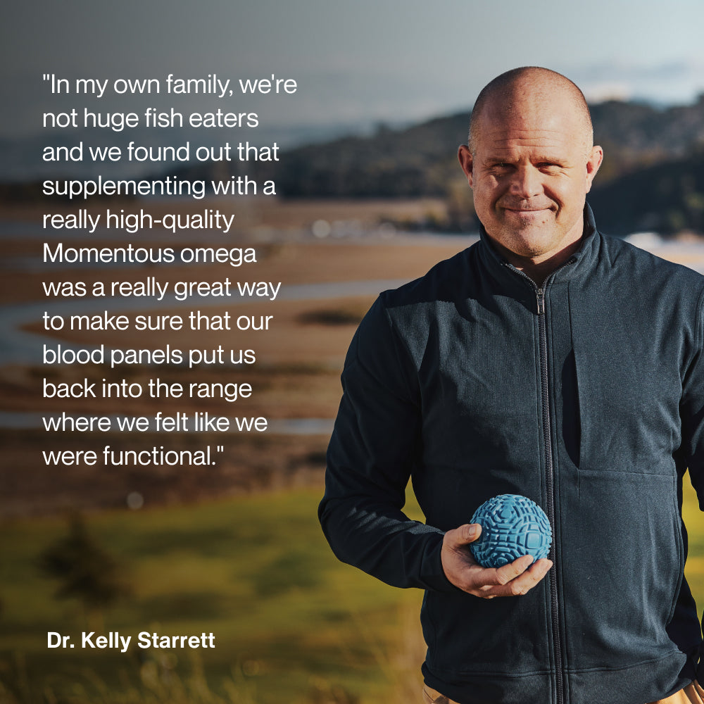 Dr. Kelly Starrett stands outdoors holding a blue mobility ball with a blurred natural landscape in the background. Text on the image reads: “In my own family, we’re not huge fish eaters and we found out that supplementing with a really high-quality Momentous omega was a really great way to make sure that our blood panels put us back into the range where we felt like we were functional.” Dr. Kelly Starrett