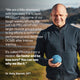 Dr. Kelly Starrett standing outdoors holding a blue massage ball. Text reads: “We are a little obsessed with how easy it is to layer PR lotion® into some of our tough weekly efforts. We just rub PR Lotion® into larger muscle groups prior to big efforts to enhance performance and decrease DOMS after intense training. It’s called PR lotion® for a reason. Go faster and be less sore? You can see why we like it.” Attribution reads: “Dr. Kelly Starrett, DPT.”
