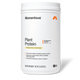 White container of Momentous Plant Protein powder in Vanilla Spice flavor, 1.5 lb size with orange logo and label details.