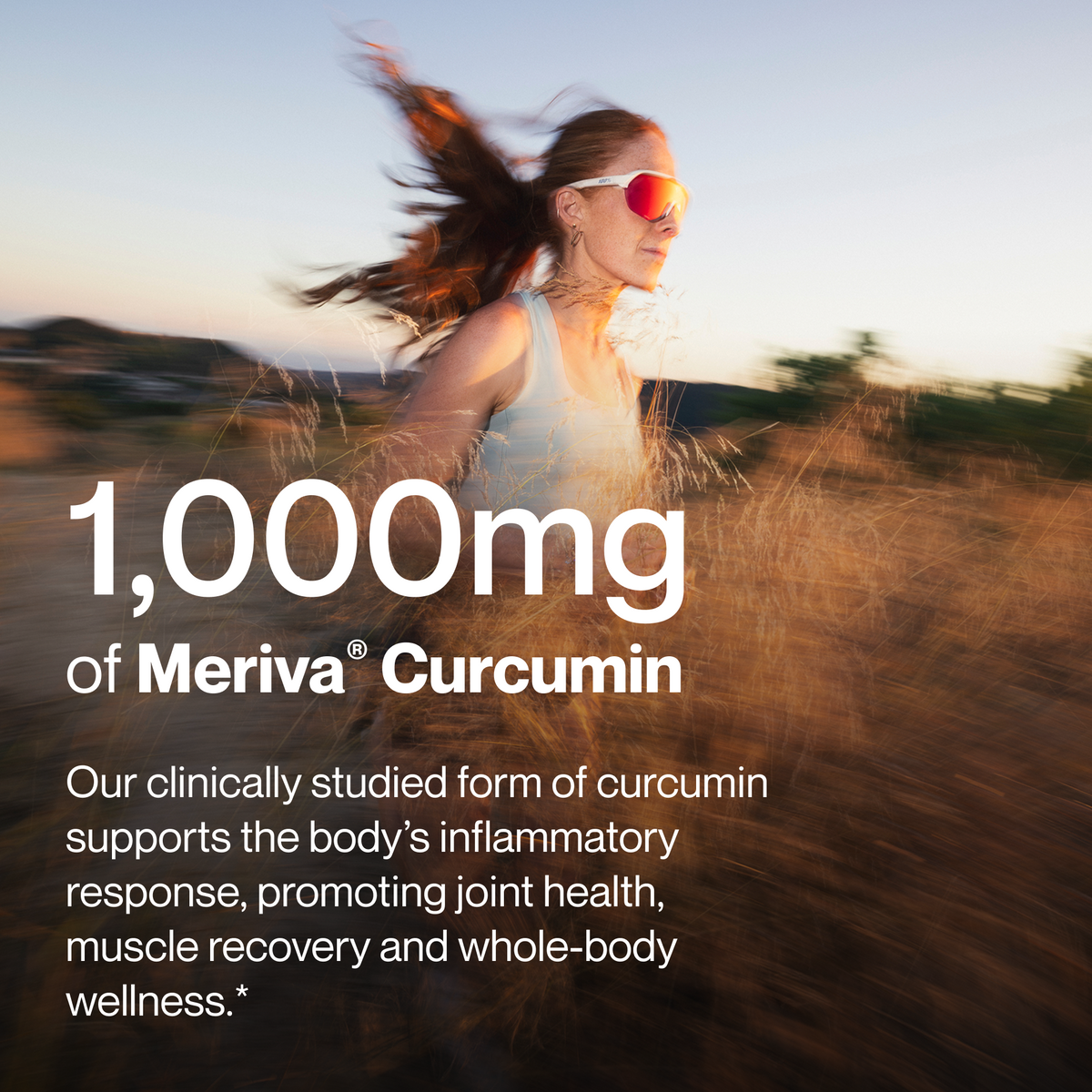 Woman in sunglasses running through tall golden grass at sunset, 1,000mg of Meriva Curcumin, our clinically studied form of curcumin supports the body’s inflammatory response, promoting joint health, muscle recovery and whole-body wellness. (240 chars)