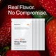 “Real Flavor. No Compromise. Momentous strawberry whey protein single-serve packets displayed with strawberries.”