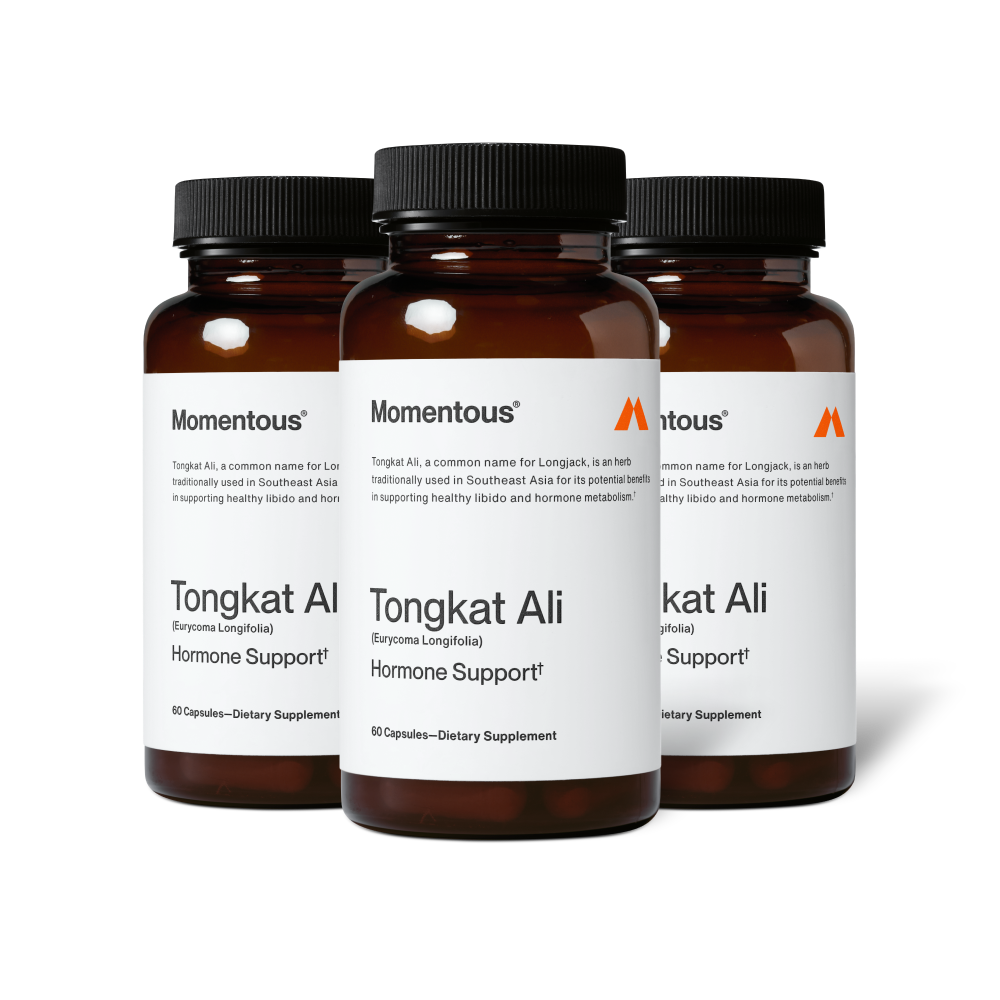 Three amber glass supplement bottles labeled “Momentous Tongkat Ali (Eurycoma longifolia) Hormone Support†.” Text includes: “Tongkat Ali, a common name for Longjack, is an herb traditionally used in Southeast Asia for its potential benefits in supporting healthy libido and hormone metabolism.” Each bottle contains 60 capsules and is labeled “Dietary Supplement.”