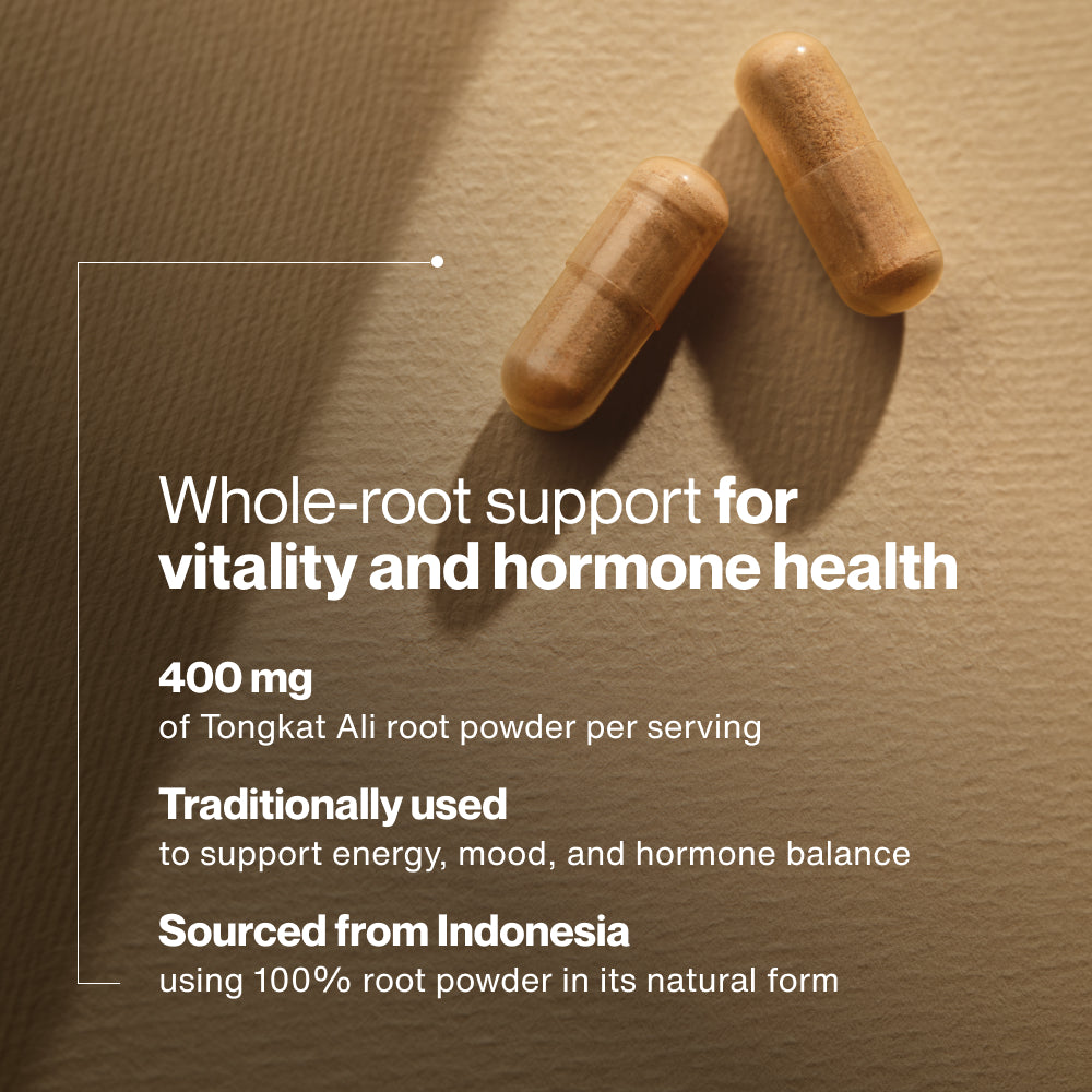 Two capsules are placed on a textured surface with soft lighting. Text on the image reads: “Whole-root support for vitality and hormone health” “400 mg of Tongkat Ali root powder per serving” “Traditionally used to support energy, mood, and hormone balance” “Sourced from Indonesia using 100% root powder in its natural form”