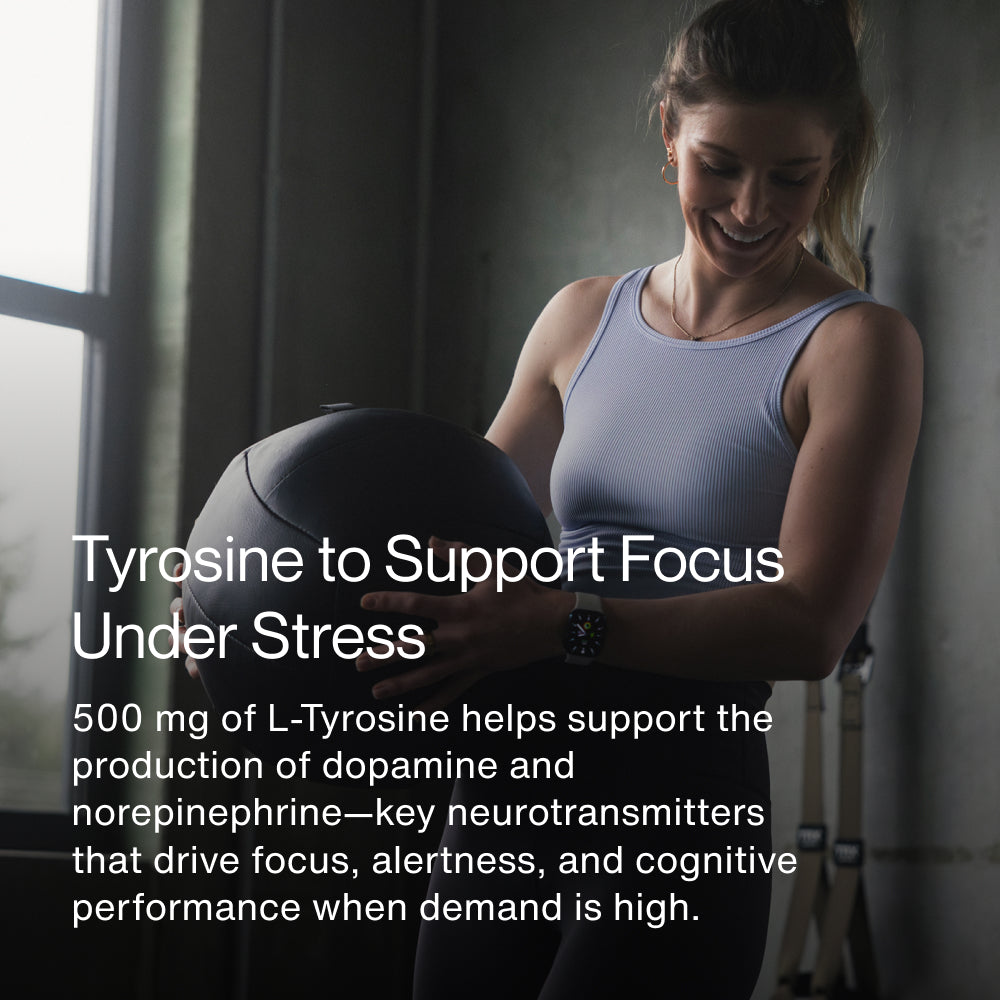 Athletic woman holding a medicine ball in a gym setting. Text reads: “Tyrosine to Support Focus Under Stress. 500 mg of L-Tyrosine helps support the production of dopamine and norepinephrine—key neurotransmitters that drive focus, alertness, and cognitive performance when demand is high.”